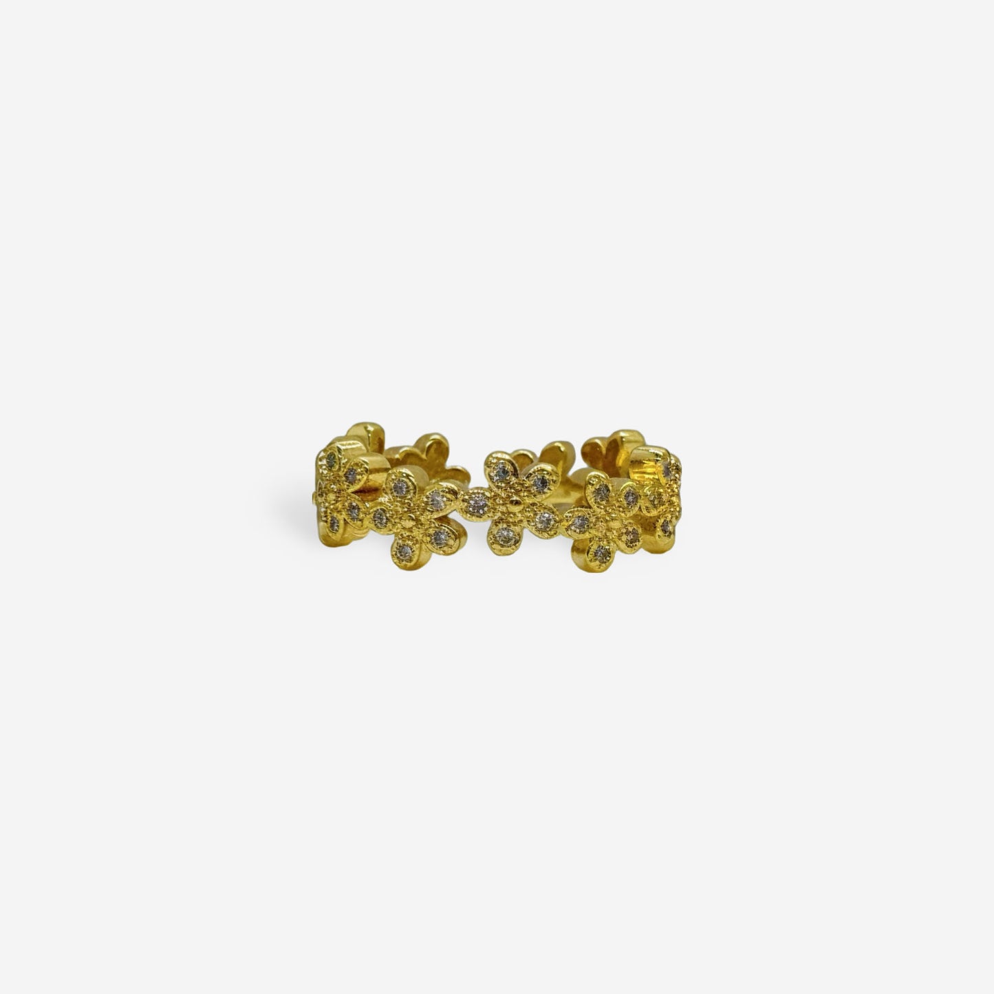Anillo dorado floral con circonias blancas