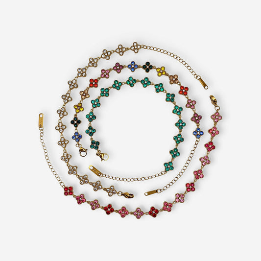 Pulsera Trébol Dorada de acero inoxidable 304 con baño de oro de 18k y circonias de colores.