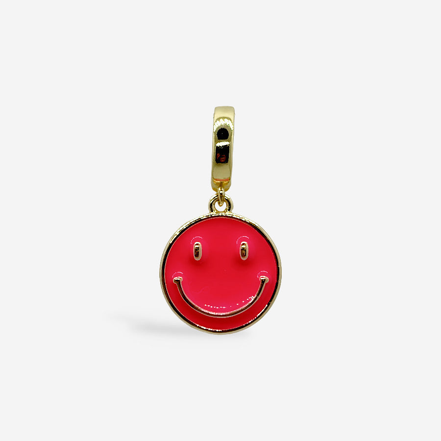 Dije redondo con carita feliz en fucsia y dorado