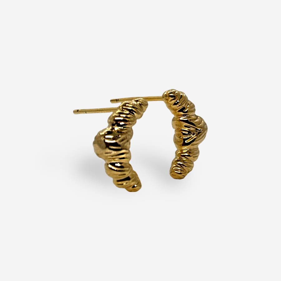 Topitos dorados texturizados estilo croissant