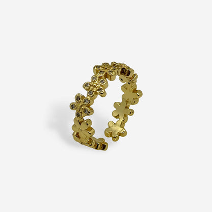 Anillo dorado ajustable con flores y circonias