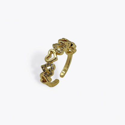 Anillo romántico dorado con circonias