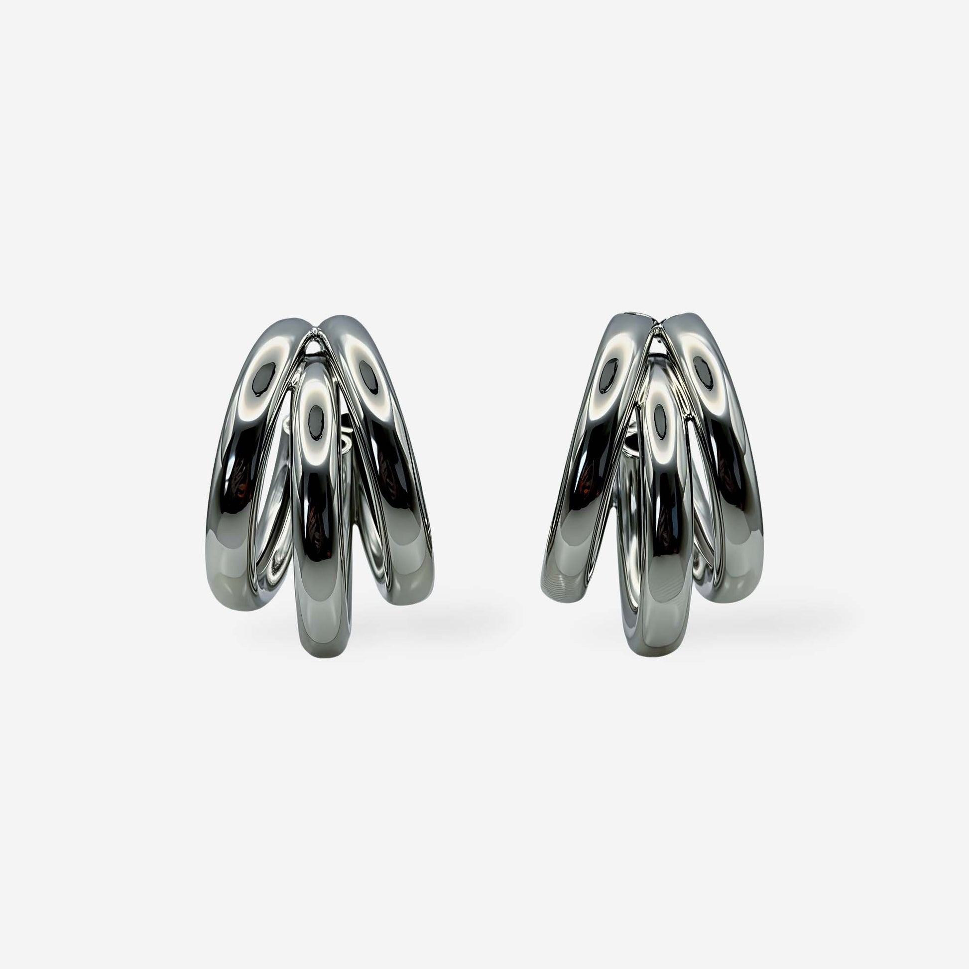 Aretes efecto triple aro elaborados en cobre con baño de rodio