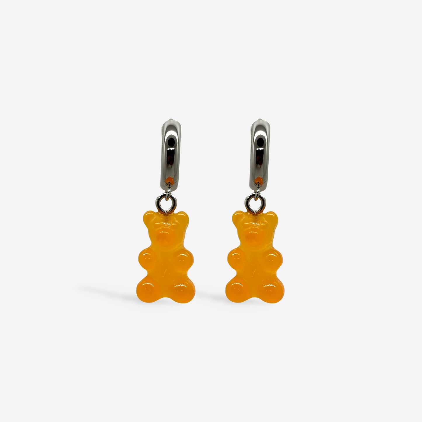 Candongas Plateadas con dijes de ositos de goma naranjas