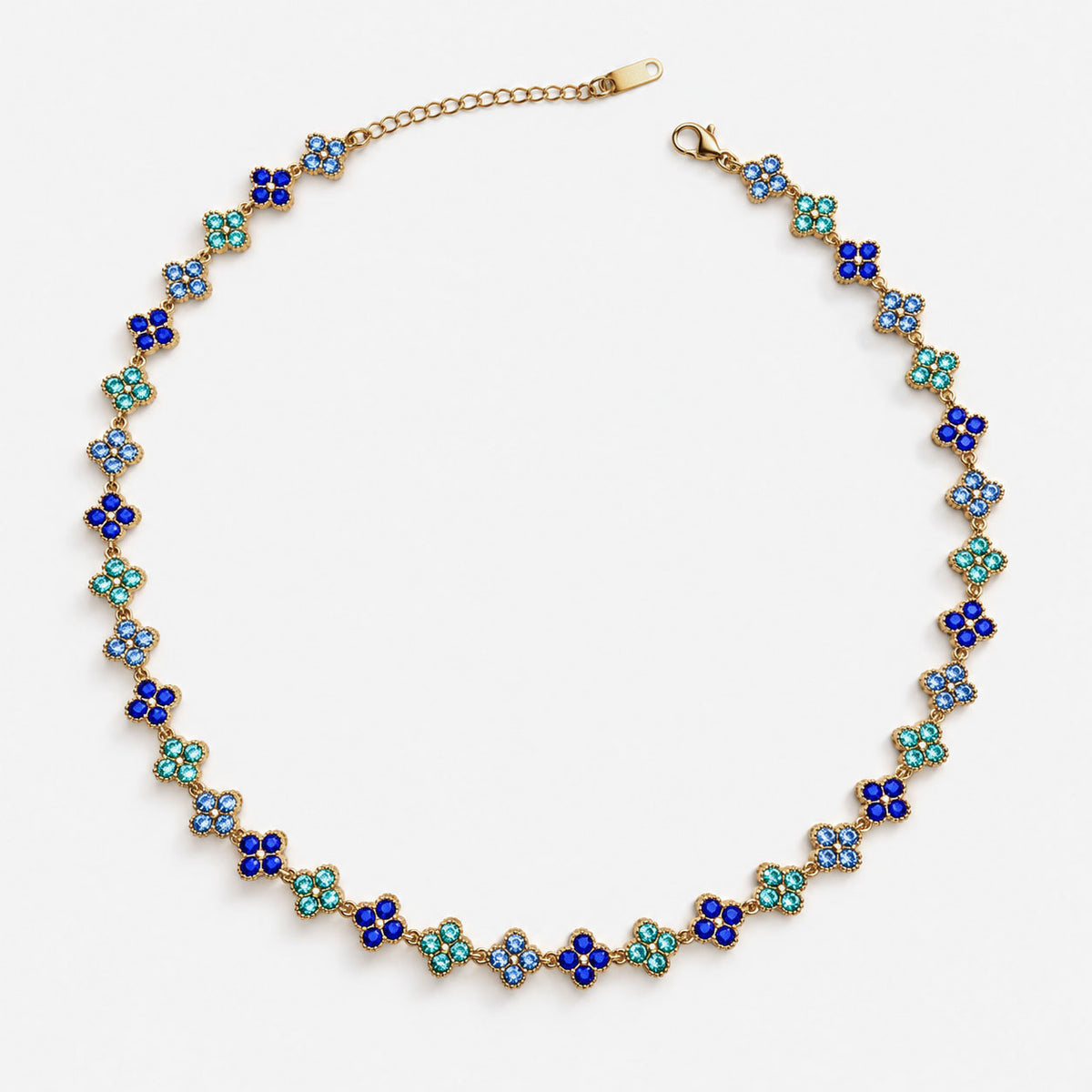 Collar Trébol Dorado con circonias azules, graduable de 37,5 a 45 cm.