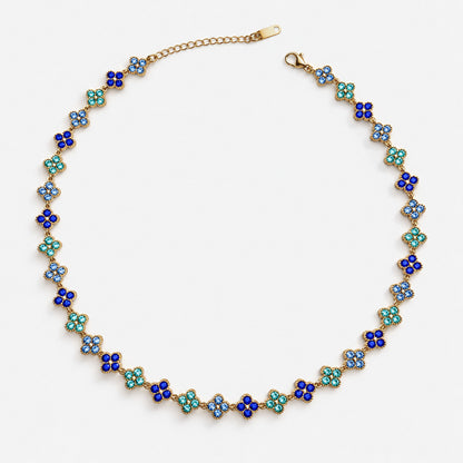 Collar Trébol Dorado con circonias azules, graduable de 37,5 a 45 cm.