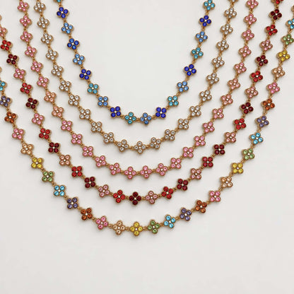 Collar Trébol Dorado de acero inoxidable 304 con baño de oro de 18k y circonias de colores.