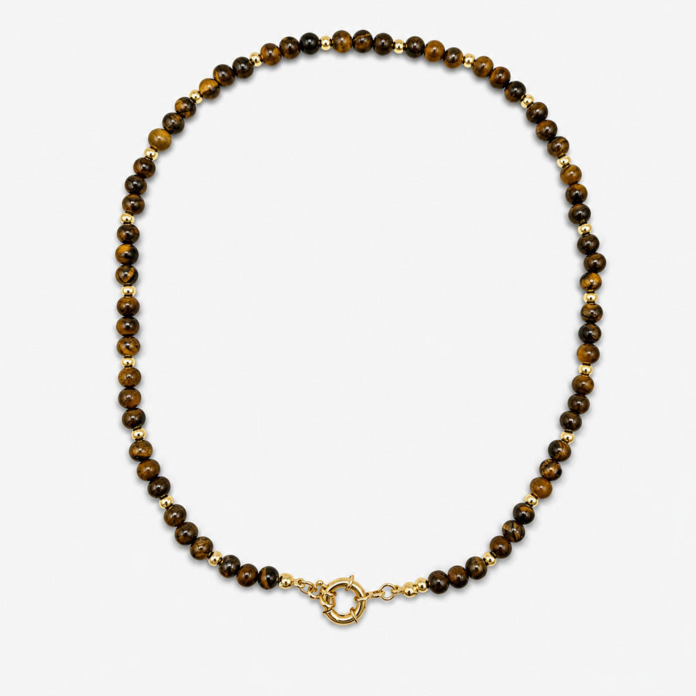 Collar para mujer elaborado con piedras naturales de ojo de tigre y detalles dorados con baño de oro de 18K.