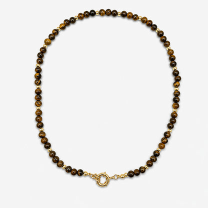 Collar para mujer elaborado con piedras naturales de ojo de tigre y detalles dorados con baño de oro de 18K.