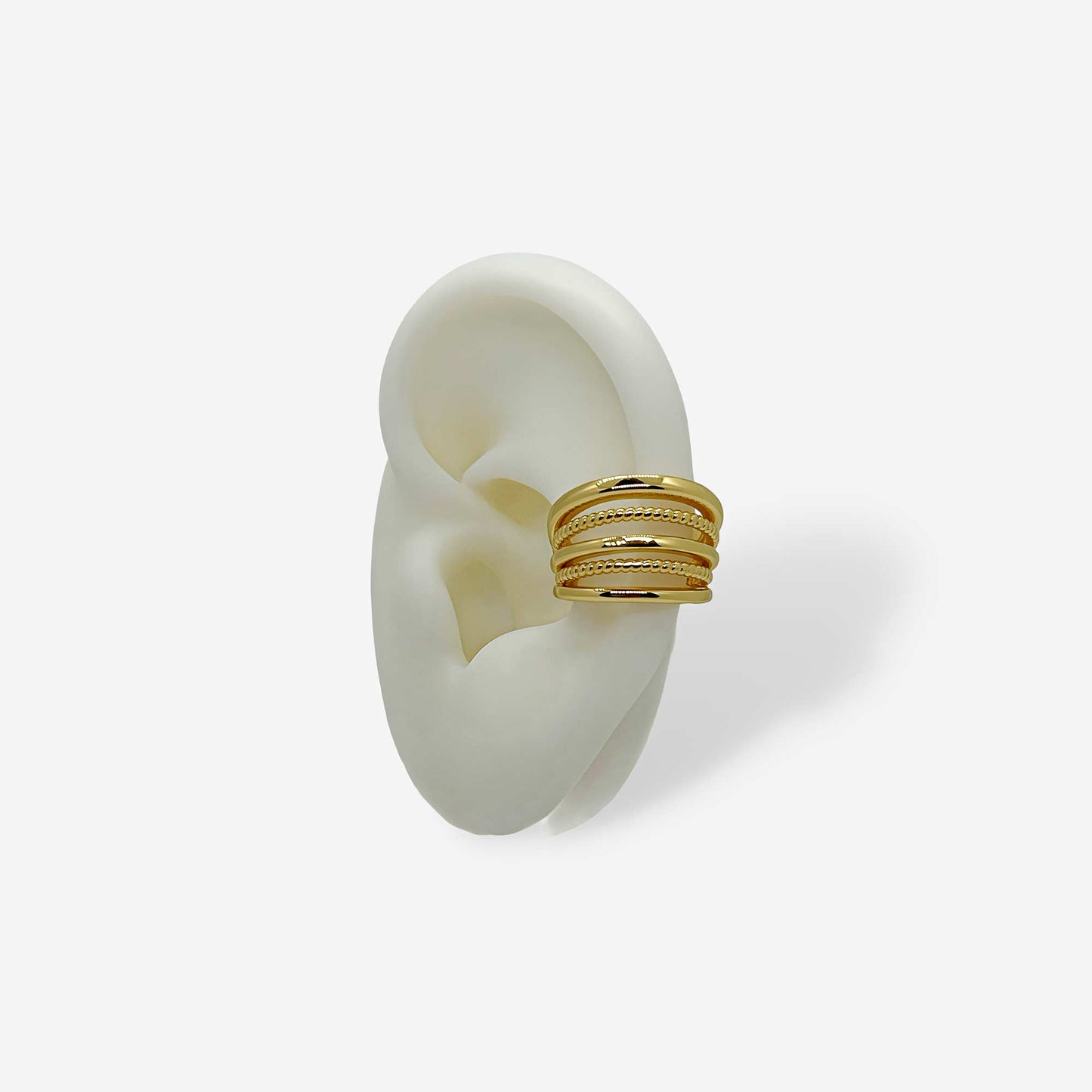 Earcuff dorado de cinco líneas en bronce con baño de oro de 18k