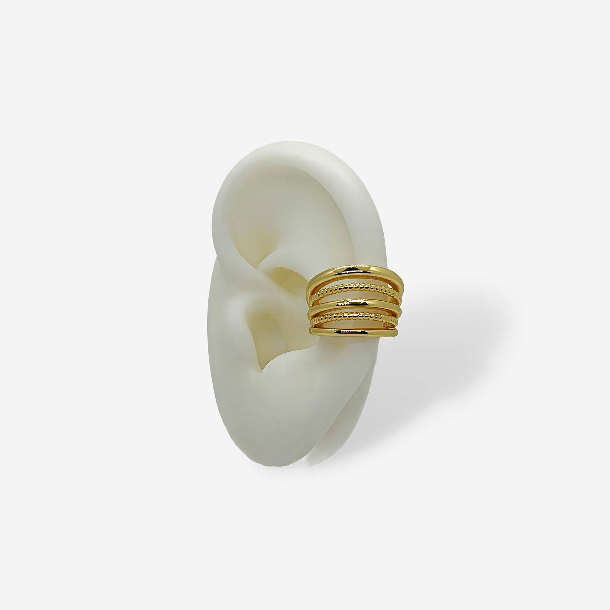 Earcuff dorado de cinco líneas en bronce con baño de oro de 18k