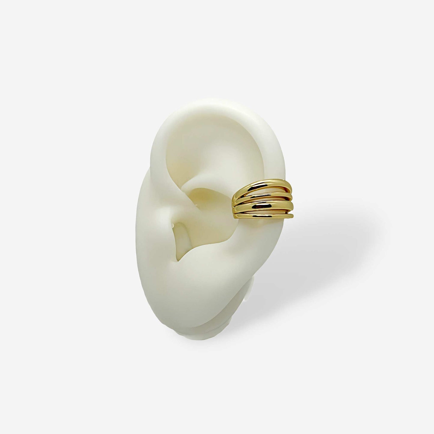 Earcuff dorado de líneas en bronce con baño de oro de 18k