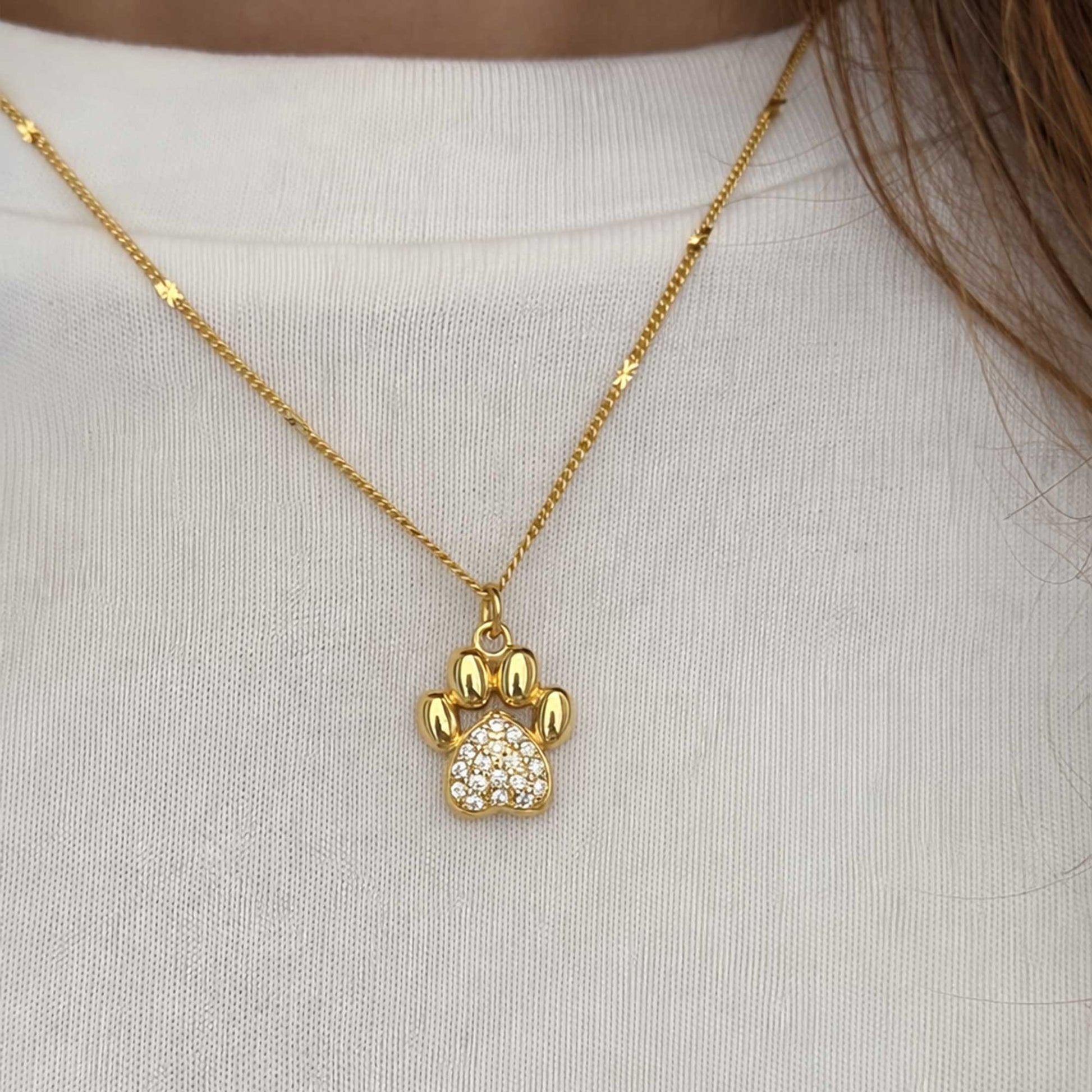 Collar dorado con dije de huella