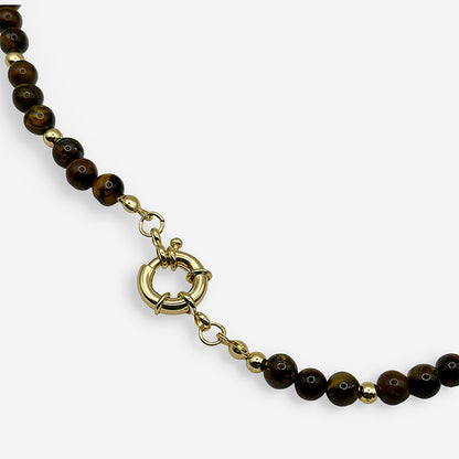 collar de ojo de tigre natural en tonos café con separadores metálicos dorados y cierre tipo marinero.
