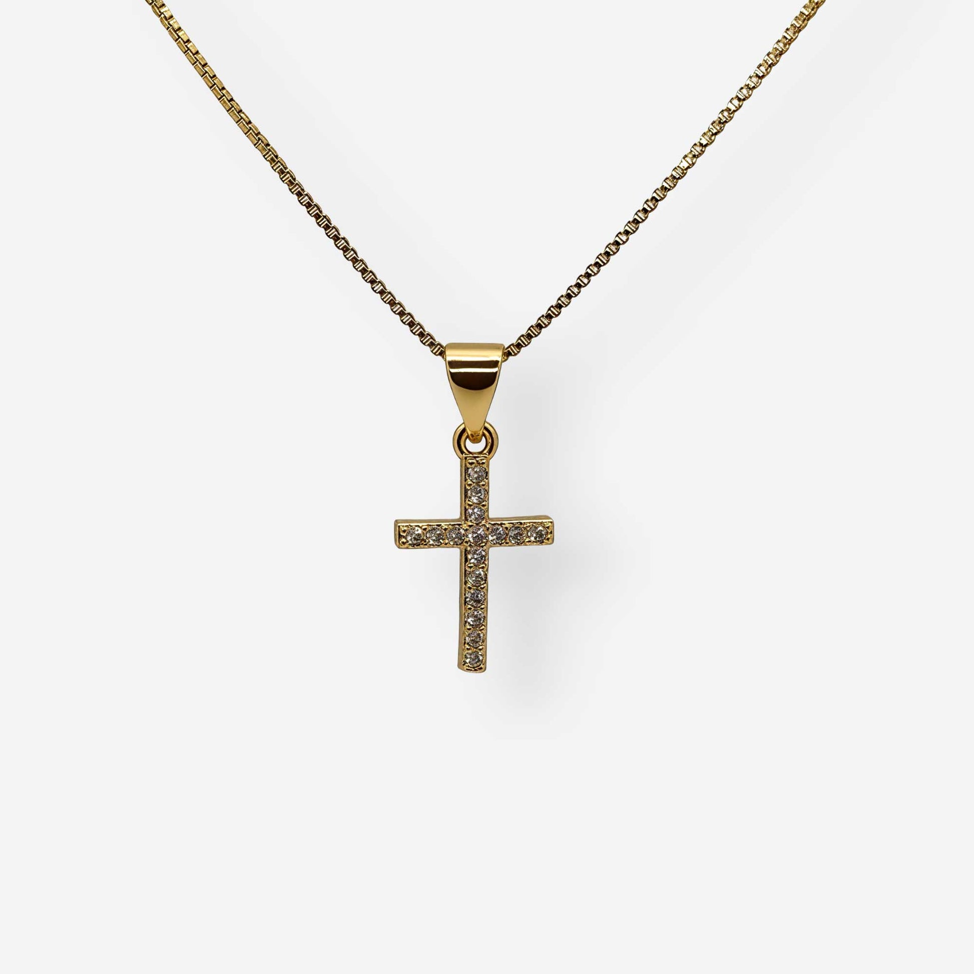 Collar de cruz pequeña en oro de 18k