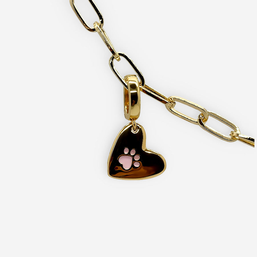 Charm de corazón dorado con huella para amantes de mascotas.