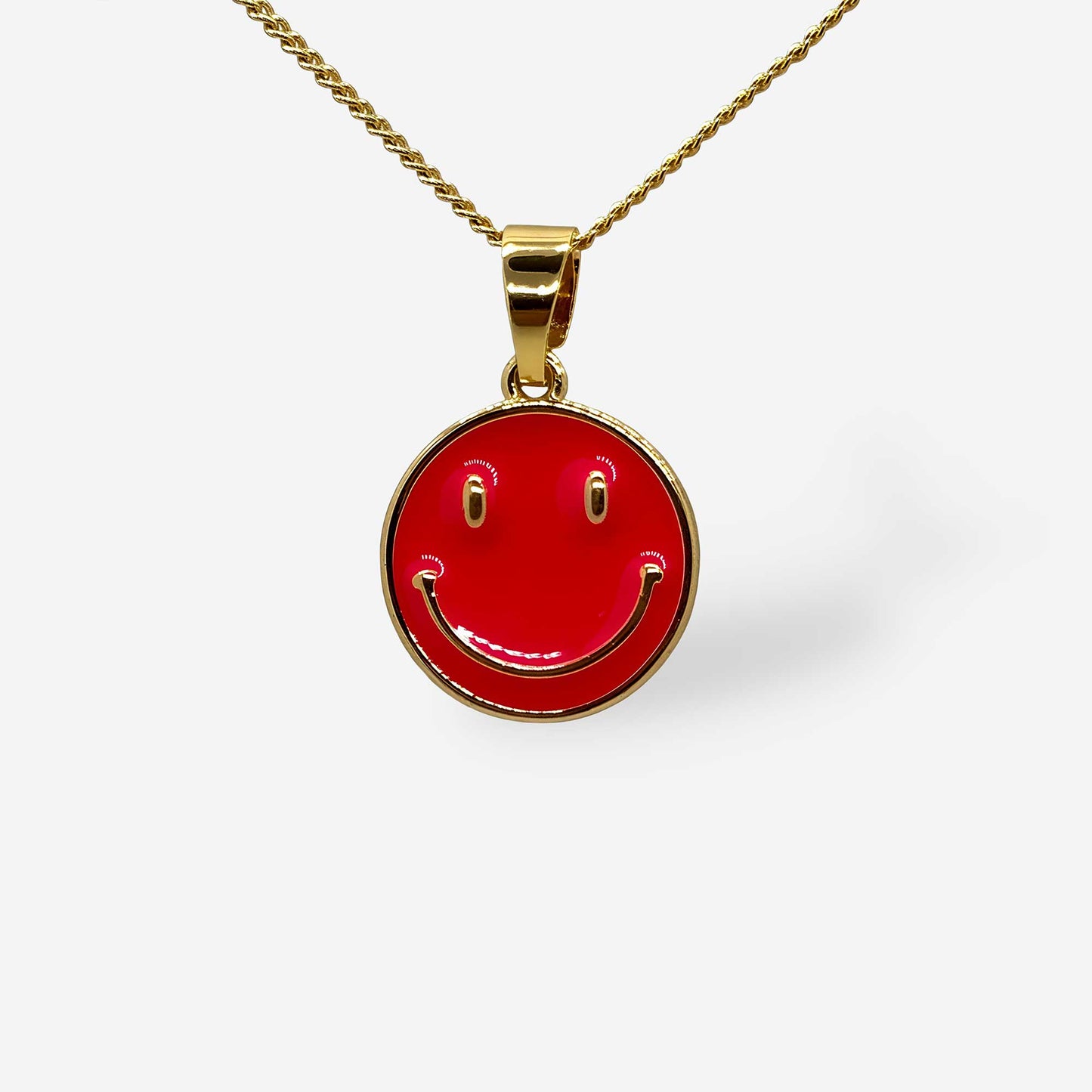 detalle dije de carita feliz fucsia con cadena dorada