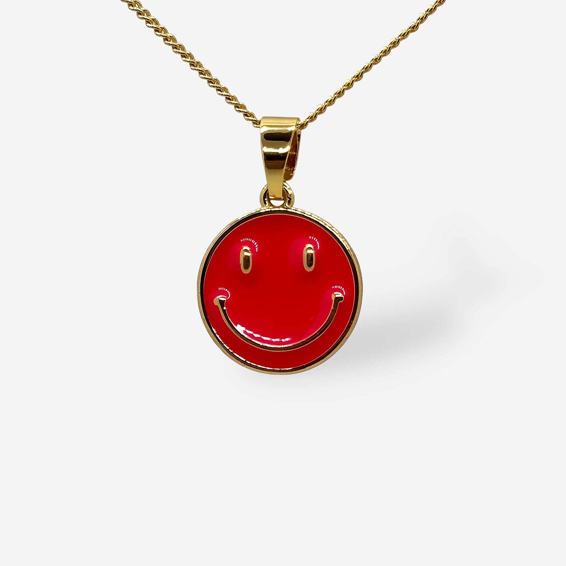 detalle dije de carita feliz fucsia con cadena dorada