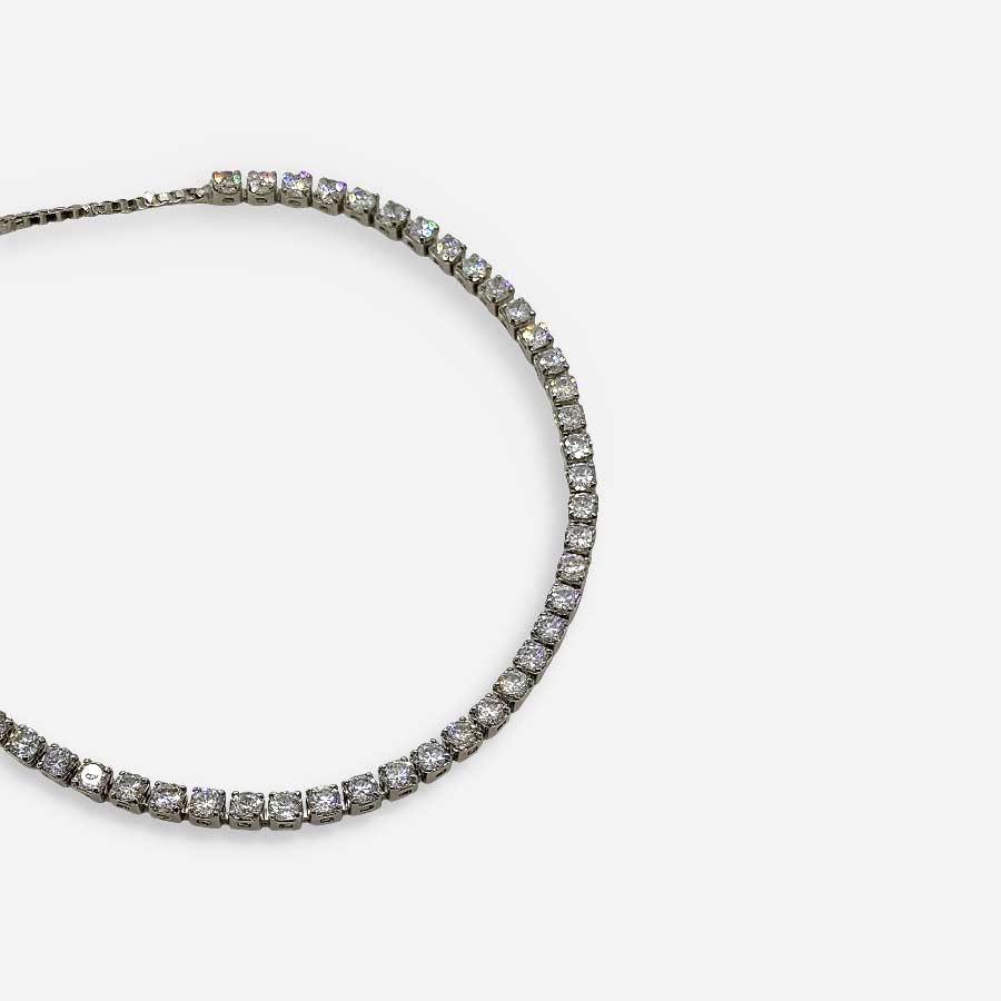 Pulsera plateada ajustable tipo tenis con circonias blancas