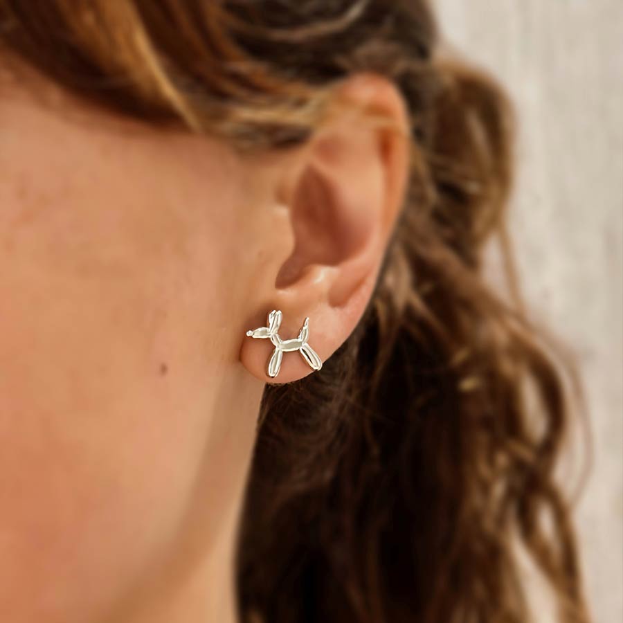 Topitos plateados en forma de perrito globo